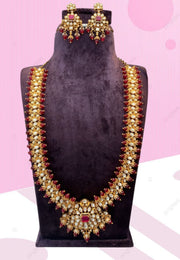 Traditional kundan stone long haram with red colour stones